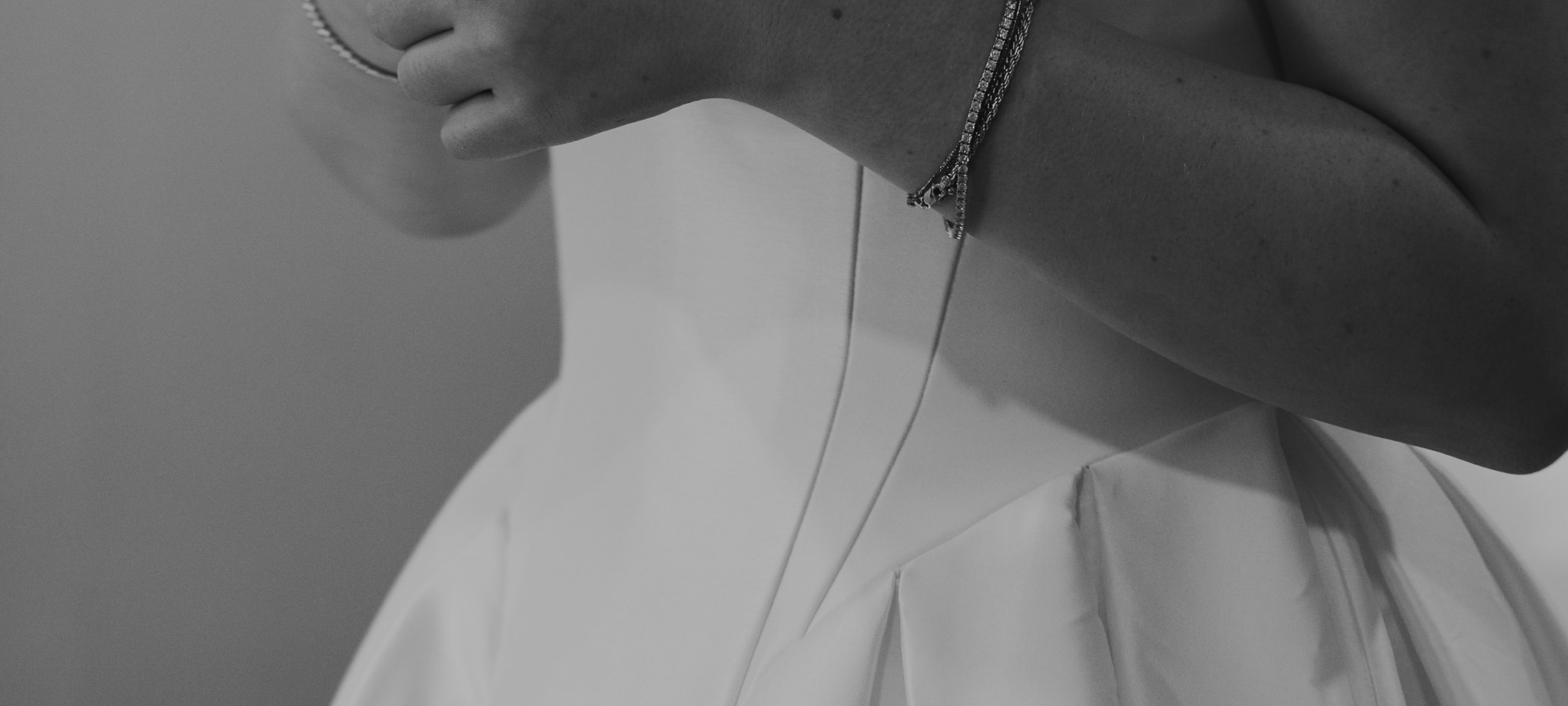 Photo of the model wearing a white gown - Desktop Image