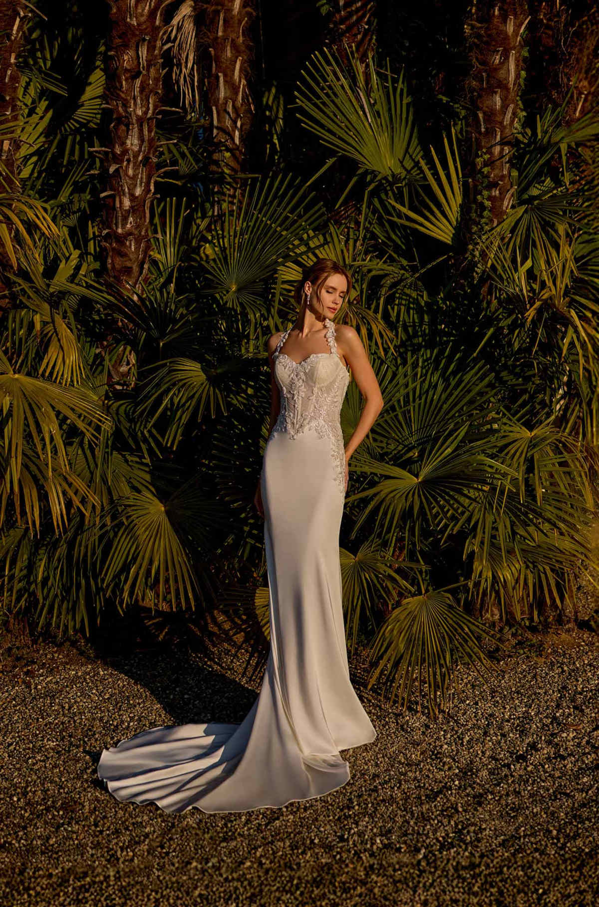 Model wearing a white gown - Mobile Image